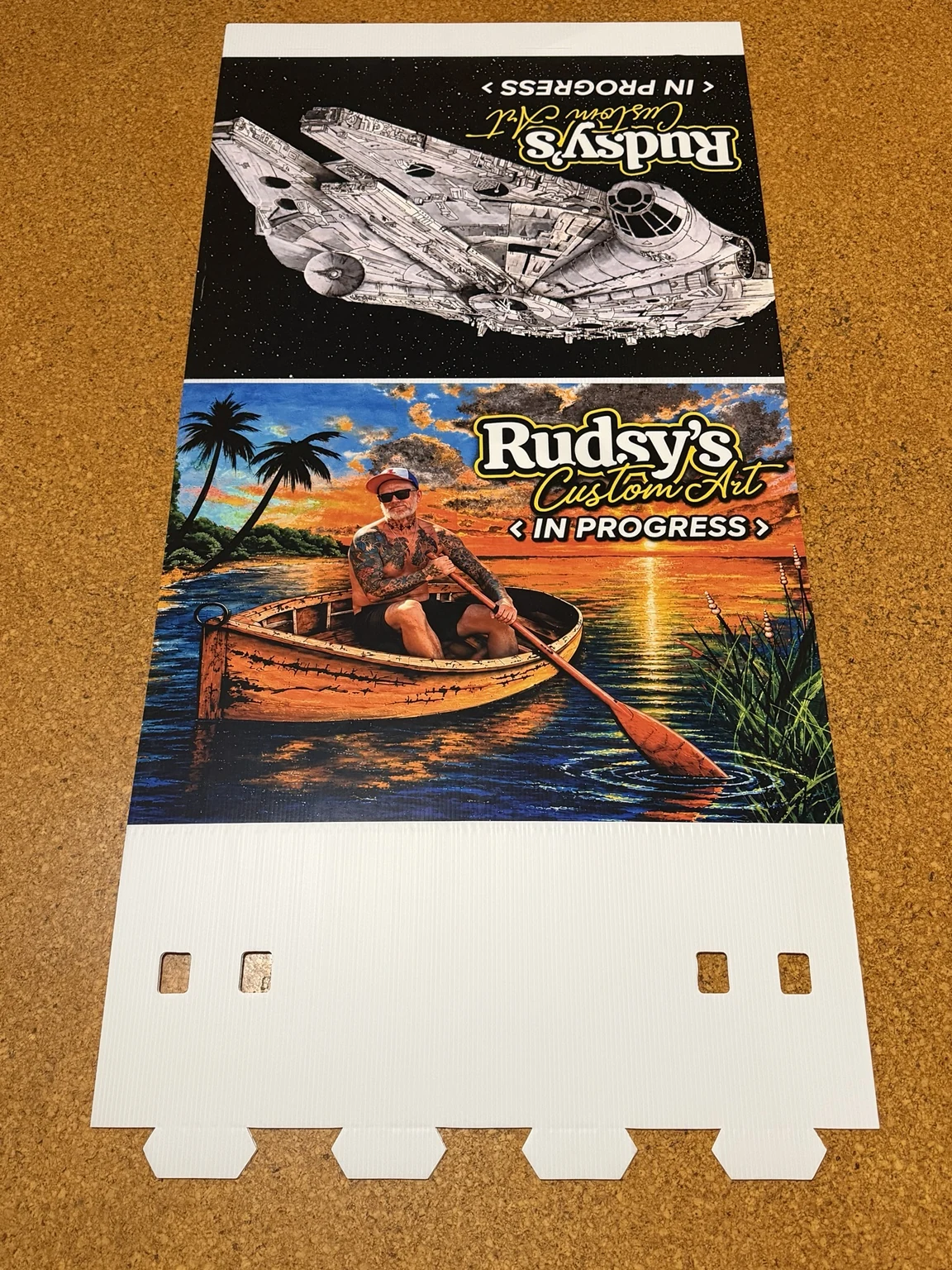 Printed graphic display samples laid out on a work surface
