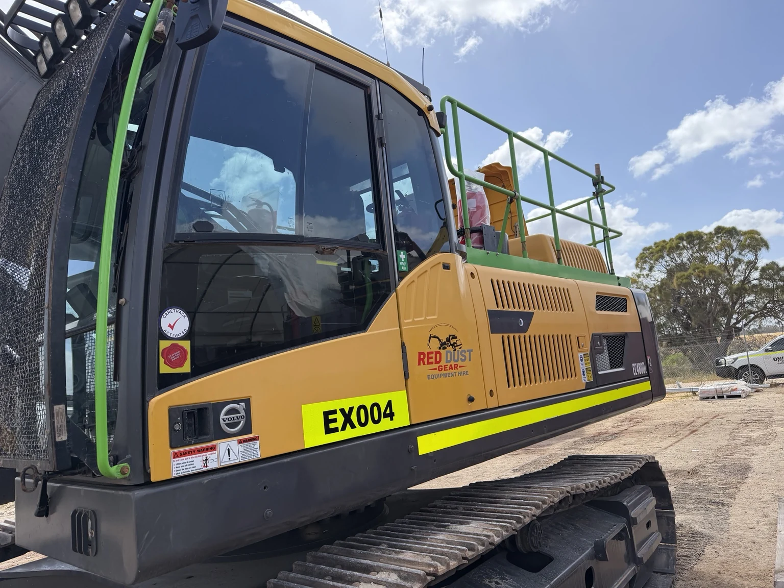 Close-up view of precision-cut machine identifiers and graphics applied to excavator
