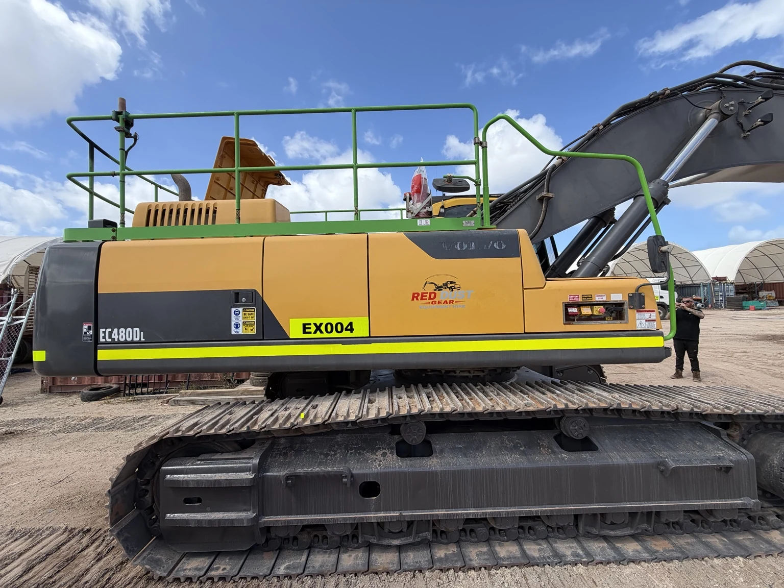 Completed Red Dust excavator safety identification and company graphics